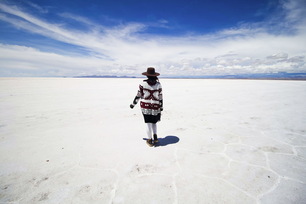 landmarks-in-south-america--woman-in-Salar-de-Uyuni